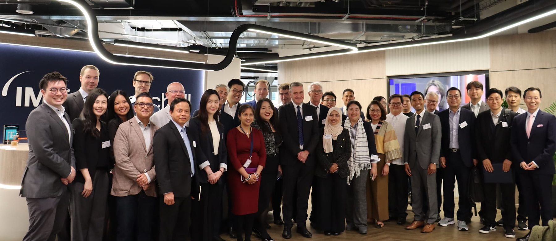 Around thirty-five delegates from across Asia and the United Kingdom standing together at the Asia Summit in London, June 2026
