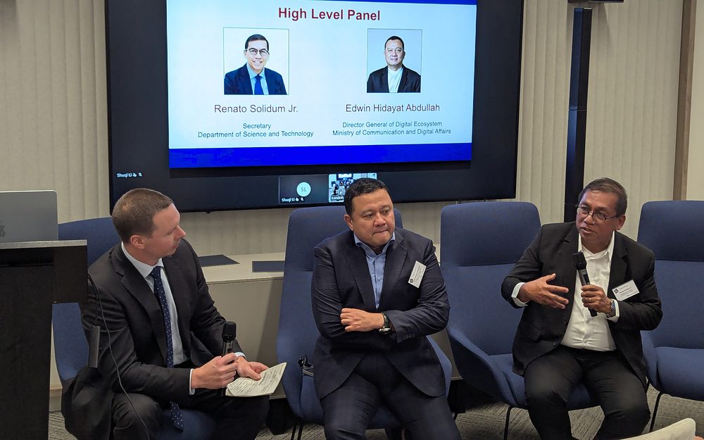 Three speakers in conversation on a panel at the Asia Summit 2026